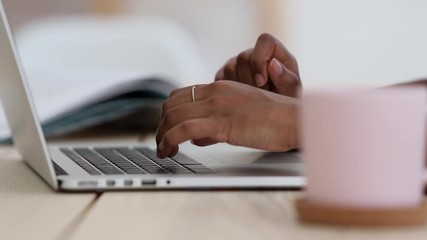 Close up of african female hands typing on laptop, important business project, work Spbi. woman write an article, letter, email. office worker using keyboard. concept business