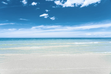 Fototapeta na wymiar Turquoise blue sea with white sand and sunny sky in summer with copy space