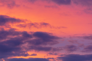 Naklejka na ściany i meble Pink dawn in the sky with clouds