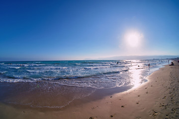 sandy beach at sunset wide angle view