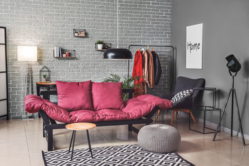 Stylish interior of living room with sofa and lamps