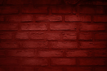 Dark red brick wall.