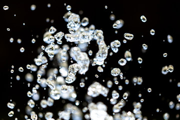 Water splashing from a fountain on summer nature