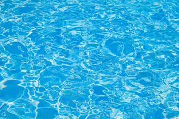 Ripple on the blue water in the pool background