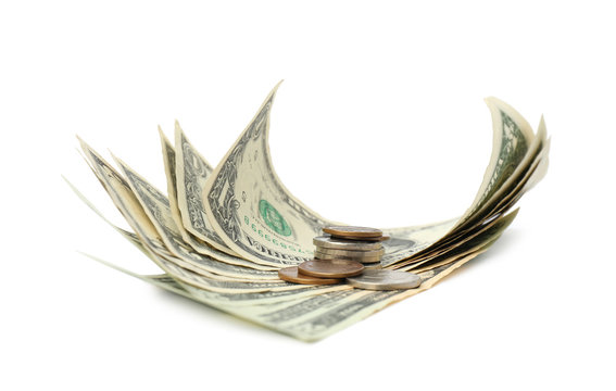 Dollar Banknotes And Stack Of Coins On White Background