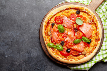 Tasty homemade seafood pizza with salmon