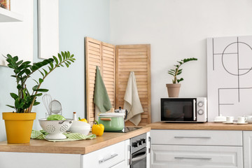 Set of utensils and products on kitchen counter