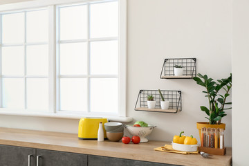 Set of utensils and products on kitchen counter