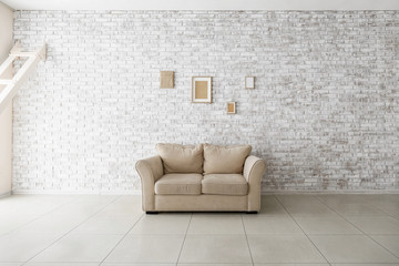 Comfortable sofa in empty room