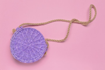 Wicker bag on color background