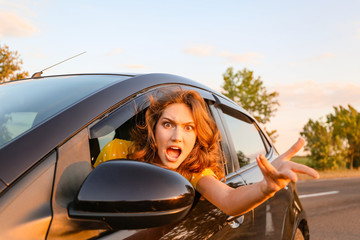 Naklejka premium Stressed young woman sitting in car