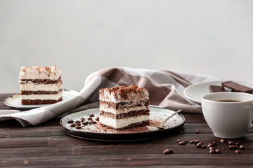 Plate with tasty tiramisu on table