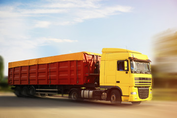 Fototapeta na wymiar Logistics concept. Truck on country road, motion blur effect