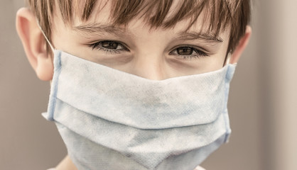 Boy in a surgical bandage. Boy in a medical mask. Quarantine and protection virus, flu, epidemic COVID-19. Coronavirus quarantine