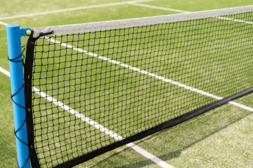 Tennis net and court. Playing Tennis. Healthy lifestyle