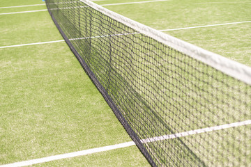 Tennis net and court. Playing Tennis. Healthy lifestyle