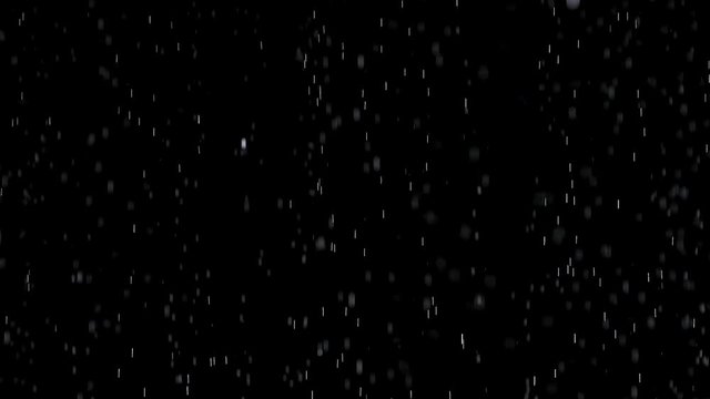 Shiny rain drops on black background in studio. Slow motion. Close up.