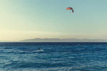 Fototapeta na wymiar Greece. Rhodes island. Rest at the sea. Euro-trip. Sea water surface. Mountains in the background.