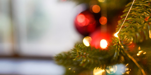 christmas banner with defocused lights and red balls