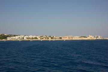 Fototapeta na wymiar Greece. Rhodes island. Rest at the sea. Euro-trip. Sea water surface. Coast of Greece.