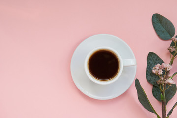 White cup of strong coffee on pink background Copy space