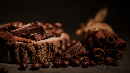 composition of coffee beans, shecolade, cinnamon and cocoa