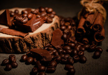 composition of coffee beans, shecolade, cinnamon and cocoa
