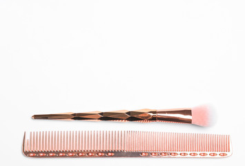 Modern hair comb and brush on white background, top view