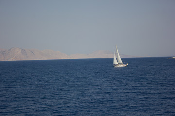 Obraz premium Greece. Rhodes island. Rest at the sea. Euro-trip. Sea water surface. Boats.