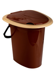 brown plastic bucket with handle and lid for the toilet in the house