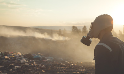 Man in gas mask in outdoors. Stop Environmental Pollution