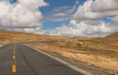 Road running through mountains in Tibet, China