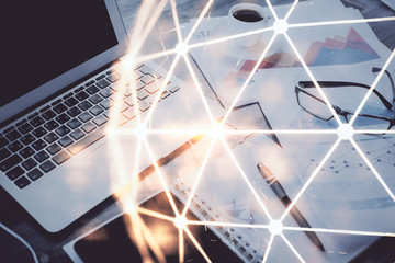 Computer on desktop with social network hologram. Double exposure. Concept of international people connections.