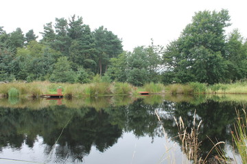 Scenic view of a fishing lake with water reflection