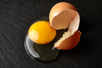 broken egg on a dark background