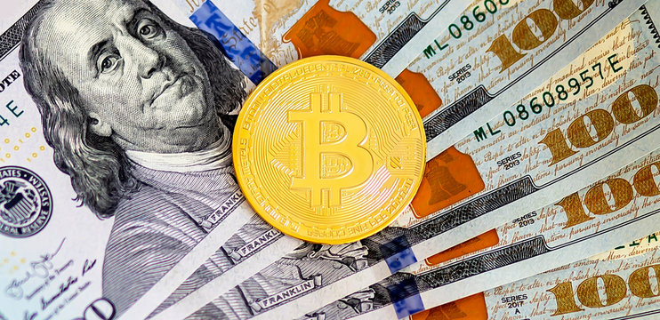 bitcoins lie in dollar bills background, financial