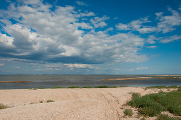 Steppe lake, landscape with clouds