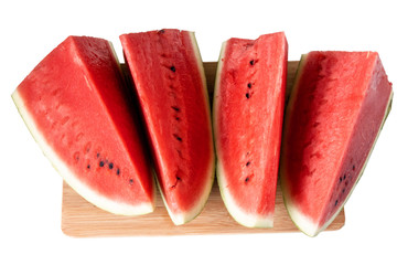 red ripe fresh sweet watermelon, cut into pieces on a wooden Board isolated