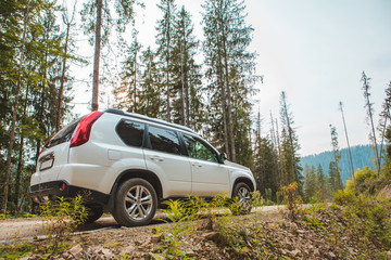 off road car travel by mountains peak autumn season