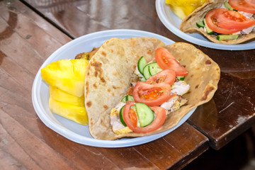 healthy breakfast vegetables and meat on a tortilla