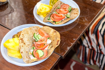 healthy breakfast vegetables and meat on a tortilla