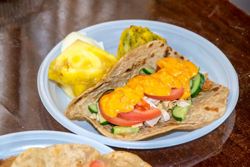 healthy breakfast vegetables and meat on a tortilla