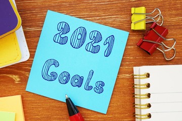 Business concept about 2021 goals with phrase on the page.