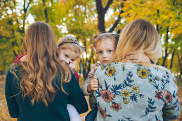 Fototapeta premium mother daughter love hug at autumn city park