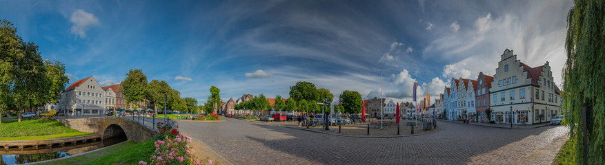 Fototapeta na wymiar Panoramic city view Marktplatz of Friedrichstadt, Dutch town in the state Schleswig-Holstein with the romantic canals situated on the river Eider and Treene, Nord frisia, Germany