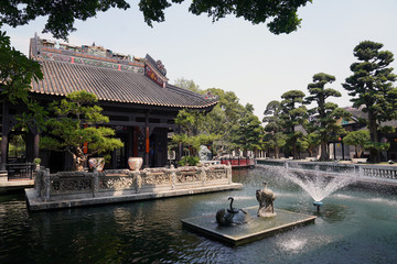 a fountain in the park with feng Shui symbols. A snake lying on a turtle and a crane. They symbolize happiness , good luck and protection from all sorts of misfortunes. Baomo park, Guangzhou China
