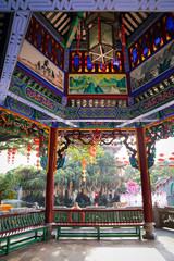 historic garden with traditional structures and popular water features filled with koi fish. Baomo park, Guangzhou China	