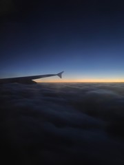 airplane in the sky at sunset