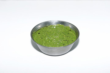 Healthy Green Chutney Made with Coriander, Mint And Spices. isolated on White Background.