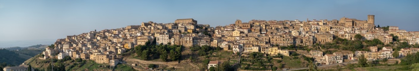 Fototapeta na wymiar Tricarico town, Matera. Italy. Panorama wide view of Tricarico town on a hill overlooking the Norman Tower and the monastery of St. Chiara. Basilicata region